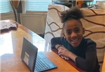 student at a laptop student at a laptop